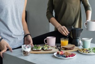 Cozy morning breakfast with avocado toast, coffee, and fresh juice.